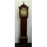 A late 18th/early 19th century mahogany longcase clock The arched top surmounted with brass eagle