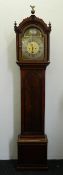 A late 18th/early 19th century mahogany longcase clock The arched top surmounted with brass eagle