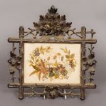 A 19th century needlework panel on silk Of foliate form,