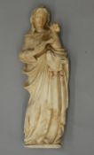 An antique alabaster figural group Modelled as the Madonna and Child. 40 cm high.