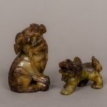 Two Chinese carved hardstone dogs-of-fo One modelled seated, the other on all fours. The former 9.