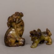 Two Chinese carved hardstone dogs-of-fo One modelled seated, the other on all fours. The former 9.