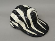 A black and white 'Pearly King' style baseball cap Approximate size 58 or 7 1/8th.