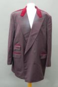 A brown jacket With red velvet contrast collar, epaulettes and piping to pockets.