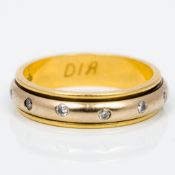 A modern 18 ct gold and diamond eternity ring - WITHDRAWN The central revolving section set with