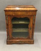 A 19th century ormolu mounted walnut pier cabinet The line inlaid moulded stepped top with a band