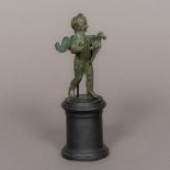 After the Antique Cherub Holding a Bird Patinated bronze,