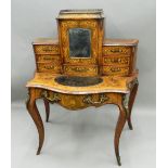 A Victorian ormolu mounted inlaid burr walnut bonheur du jour The back section with central