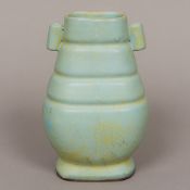 A Chinese blue ground porcelain crackle glaze vase Of twin handled archaistic form. 18.5 cm high.