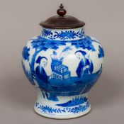 An 18th/19th century Chinese blue and white porcelain lidded vase Of squat baluster form,