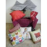 Large selection of various assorted checked and other scatter cushions