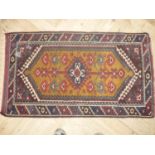 Small rectangular Persian style woollen rug (75cm x 140cm)
