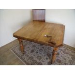 Victorian wind-out beech dining table with additional leaf on turned supports