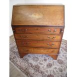 Edwardian mahogany inlaid bureau with fall front revealing fitted interior above four drawers (width