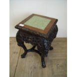Chinese carved hardwood jardinière stand with rectangular top inset with green marble panel, on four