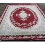 Extremely large Chinese woollen beige and red ground carpet (width 255cm)