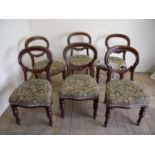 Set of six Victorian mahogany balloon back dining chairs on turned supports with upholstered seats