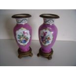 Pair of Sevres style continental porcelain vases with ormolu mounts, twin floral panels on pink