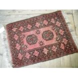 Small red ground prayer style rug (71cm x 49cm)