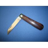 A Sheffield made 3 inch bladed folding pocket knife with two piece wooden grips