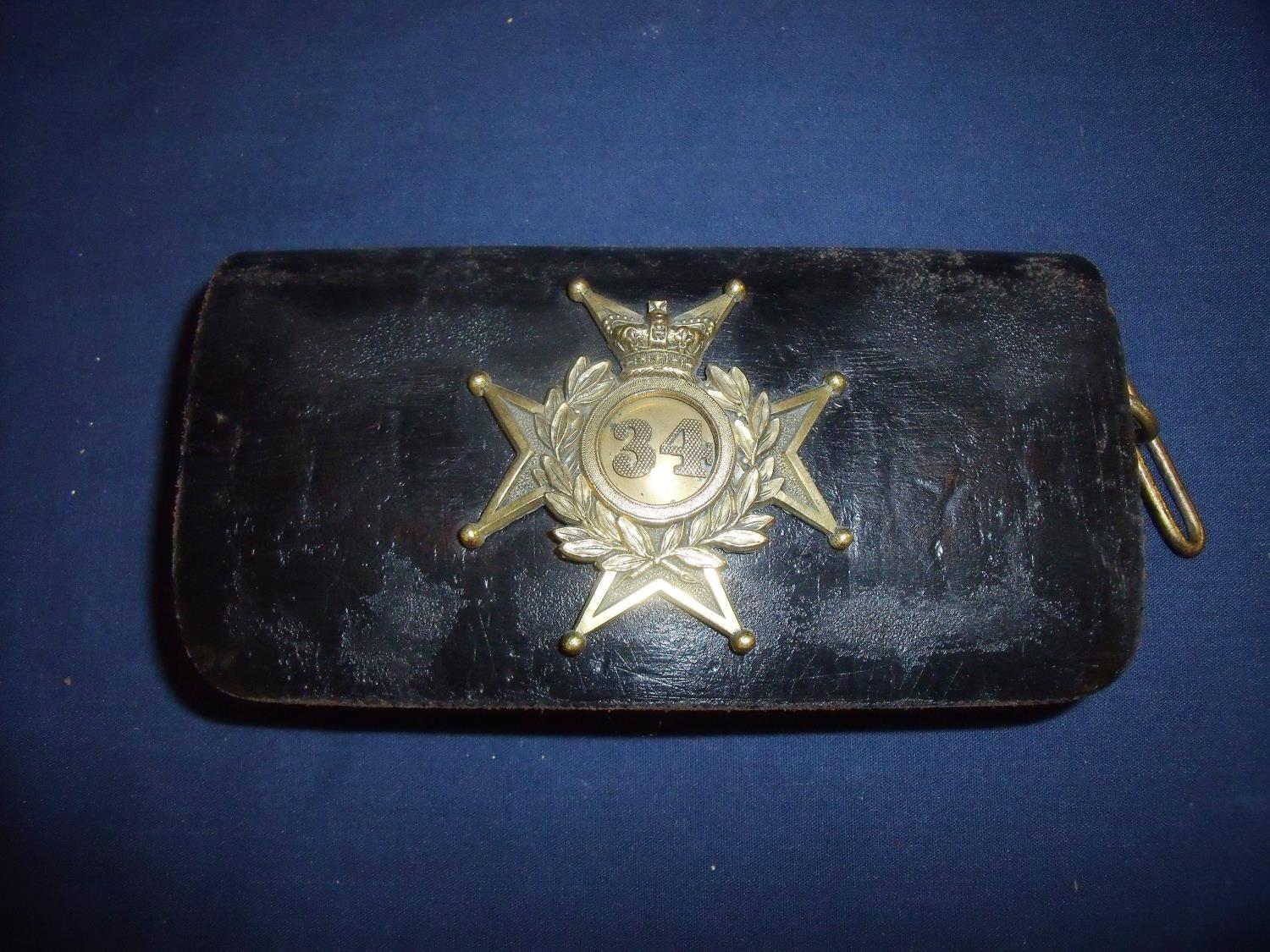 Victorian 34th (Cumberland) Regiment pouch with gilt metal flap badge and belt strap mounts of