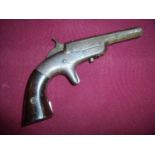 Bacon .32 rimfire Derringer pistol serial number 1122 circa 1865, with octagonal barrel with