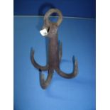 Circa 19th/20th C heavy grappling hook with four barbs and rope suspension ring (28cm high)