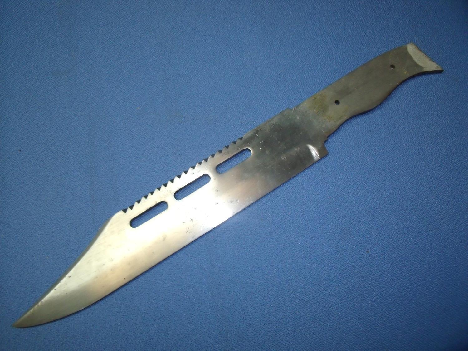 11 1/2 inch bowie type knife, the blade with saw edge top (lacking grips)