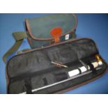 Canvas and leather trim cartridge bag and a Bisley padded cased part shotgun cleaning kit (2)