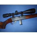 Anschutz 22LR semi auto rifle fitted with sound moderator and Hawke 4-16x50 IR Mil. scope with