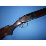 Baikal 12 bore over & under ejector shotgun with 27.5 inch barrels, vented raised top rib, choke 1/2