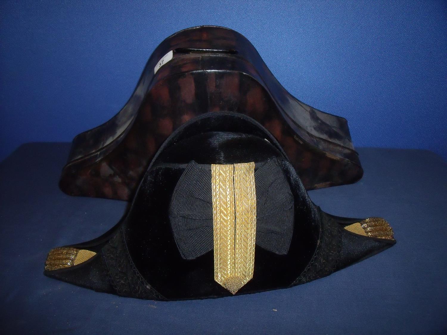 Naval officers bicorn hat with gilt braided mounts at fore and aft peaks with central braid and silk