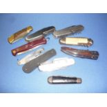 Group of ten pocket knives including single bladed, multi-functioning etc