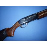 Remington Model 1100 3 shot semi auto 12 bore shotgun with 25 inch barrel and 2 3/4 inch chambers,