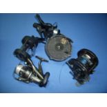 Selection of various fishing reels including spinning reels, Cobra Match 300, Sigma 2950-360, Merlin