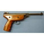 Unmarked continental style break barrel .22 air pistol with wooden grips and adjustable rear sight