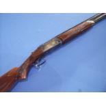 Valmet 12 bore over & under shotgun with 25 3/4 inch barrels, single trigger, 14 1/4 inch stock,