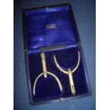 Presentation cased set of gilt metal spurs stamped Maxwell