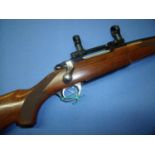 Ruger .243 bolt action rifle, model M77 with 1 inch high scope rings and screw cut barrel for