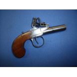Flintlock pocket pistol with 1 1/2 inch turn off barrel and top slide safety, no visible makers name