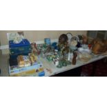 Selection of various board games, puzzles, decorative ceramics, spare light bulbs, wicker baskets,