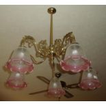 Pair of brass five branch centre light fittings with shades