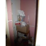 The bedroom contents store cupboard, comprising of various cleaning accessories, ironing board,