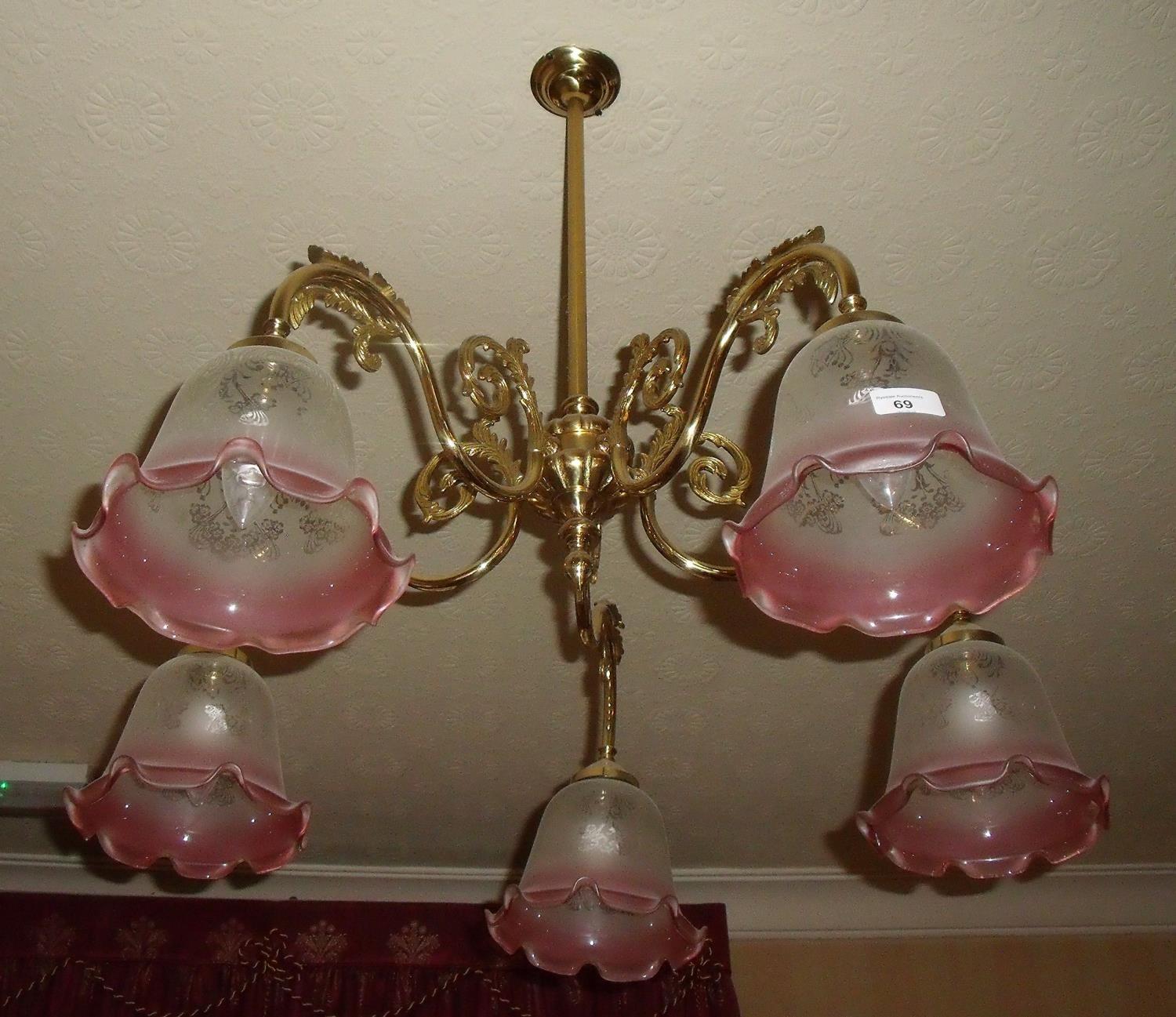 Pair of brass five branch centre light fittings with shades