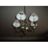 Pair of five branch brass centre light fitting and six matching twin branch wall lights