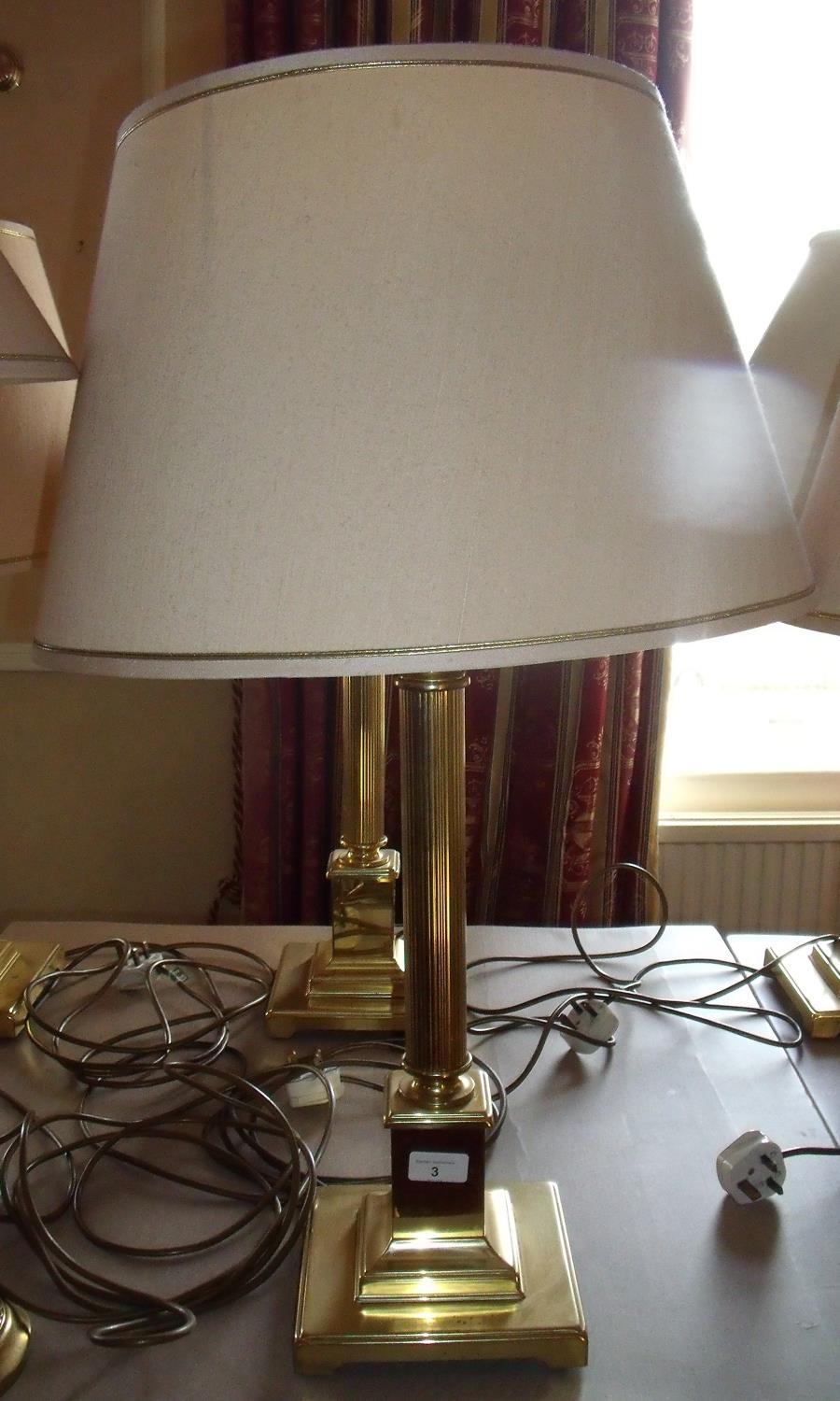 Pair of brass Corinthian column table lamps