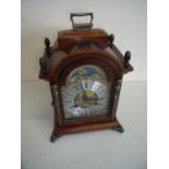 Dutch reproduction of a 19th C walnut bracket clock with striking movement (30cm high)
