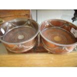 Pair of Sheffield silver plated bottle coasters (worn) with wooden bases (diameter 14cm)