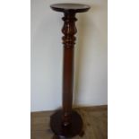 Mahogany torcher stand with octagonal column and circular base (138cm high)