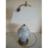 Four ceramic table lamps with twin lion mast mounts